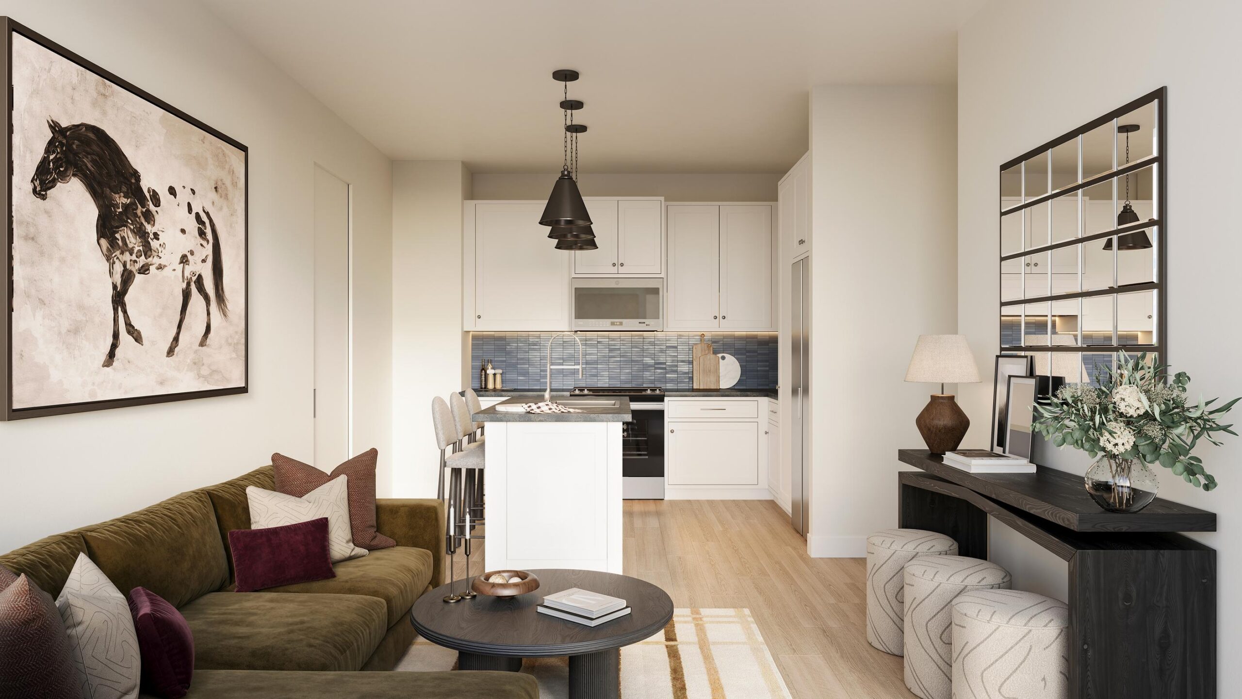 Ryder at Willow Brook Modern living room and kitchen with green sofa, horse painting, bar stools, and decorative accents in neutral tones.